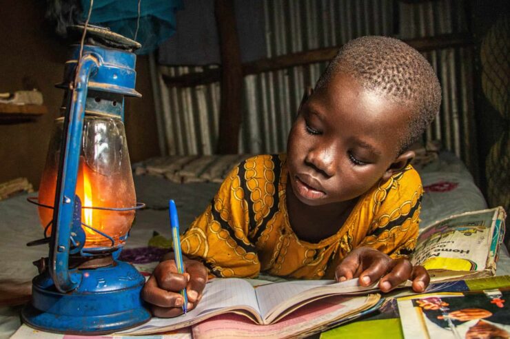 Image for Learning by lamplight, against the odds: photo depicts ‘safety’ for child refugee